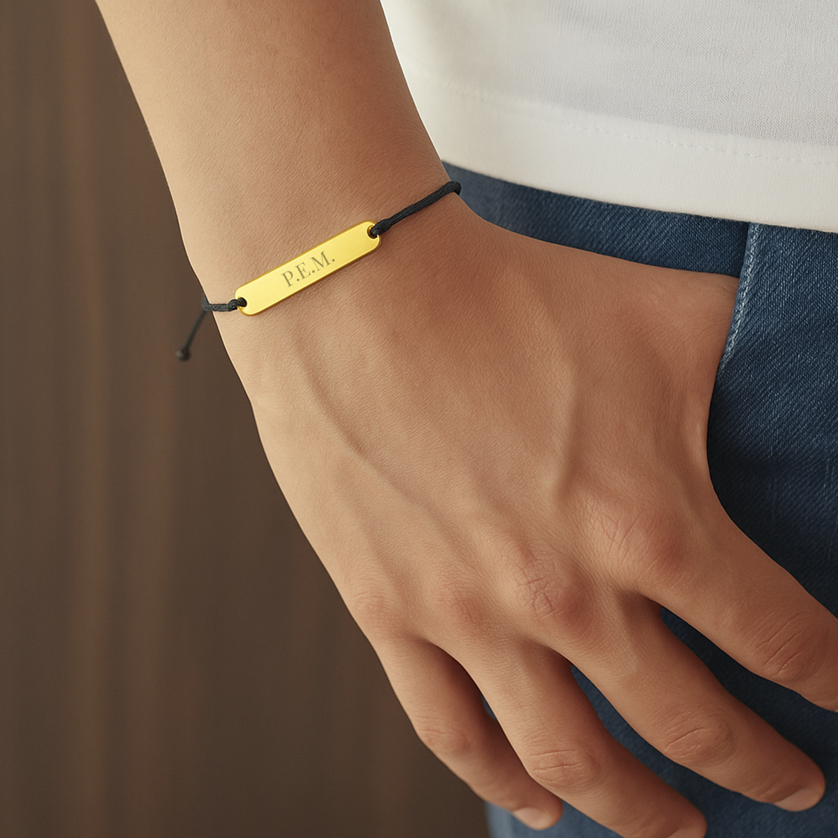 Pulsera tejida con placa grabada de Acero